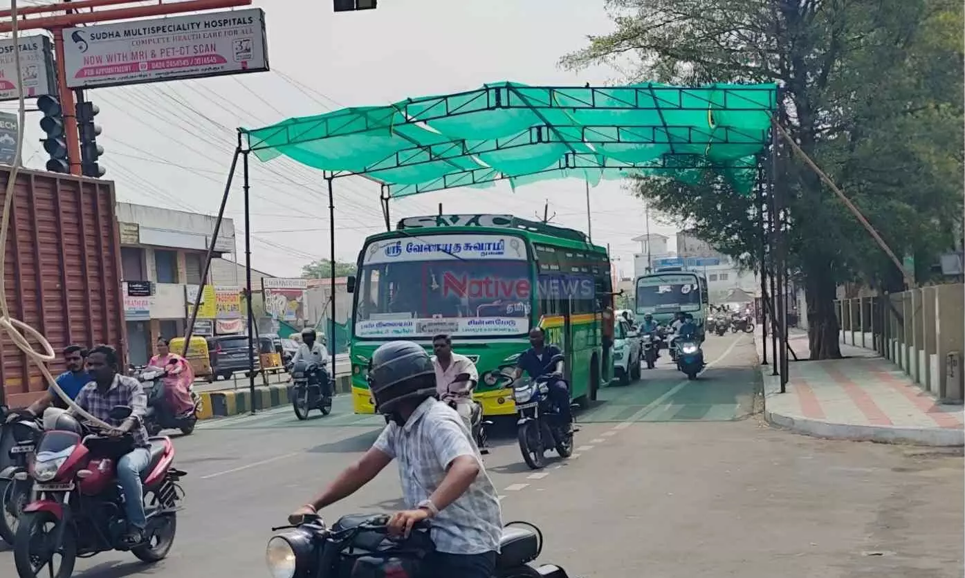 ஈரோடு ஆட்சியர் அலுவலகம் முன்பு உள்ள சிக்னலில் நிழல் தரும் பந்தல் அமைப்பு ஈரோடு ஆட்சியர் அலுவலகம் முன்பு உள்ள சிக்னலில் நிழல் தரும் பந்தல் அமைப்பு